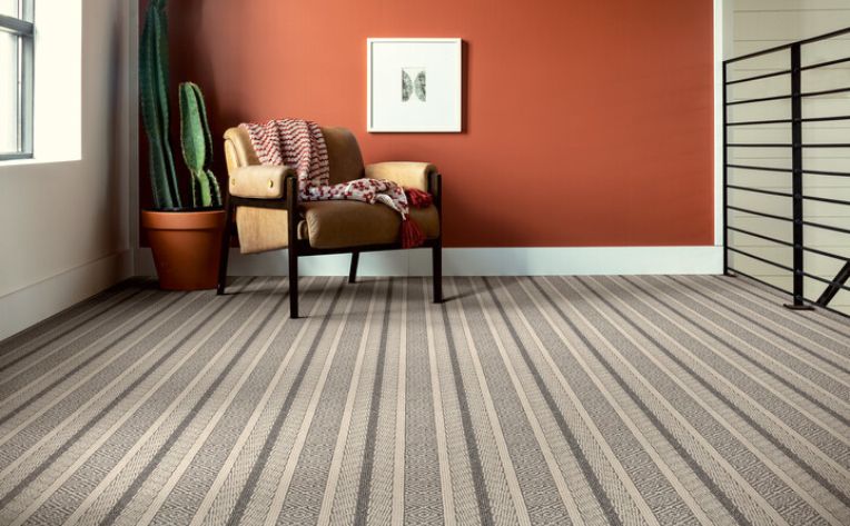 striped patterned carpet in southwest themed sitting area